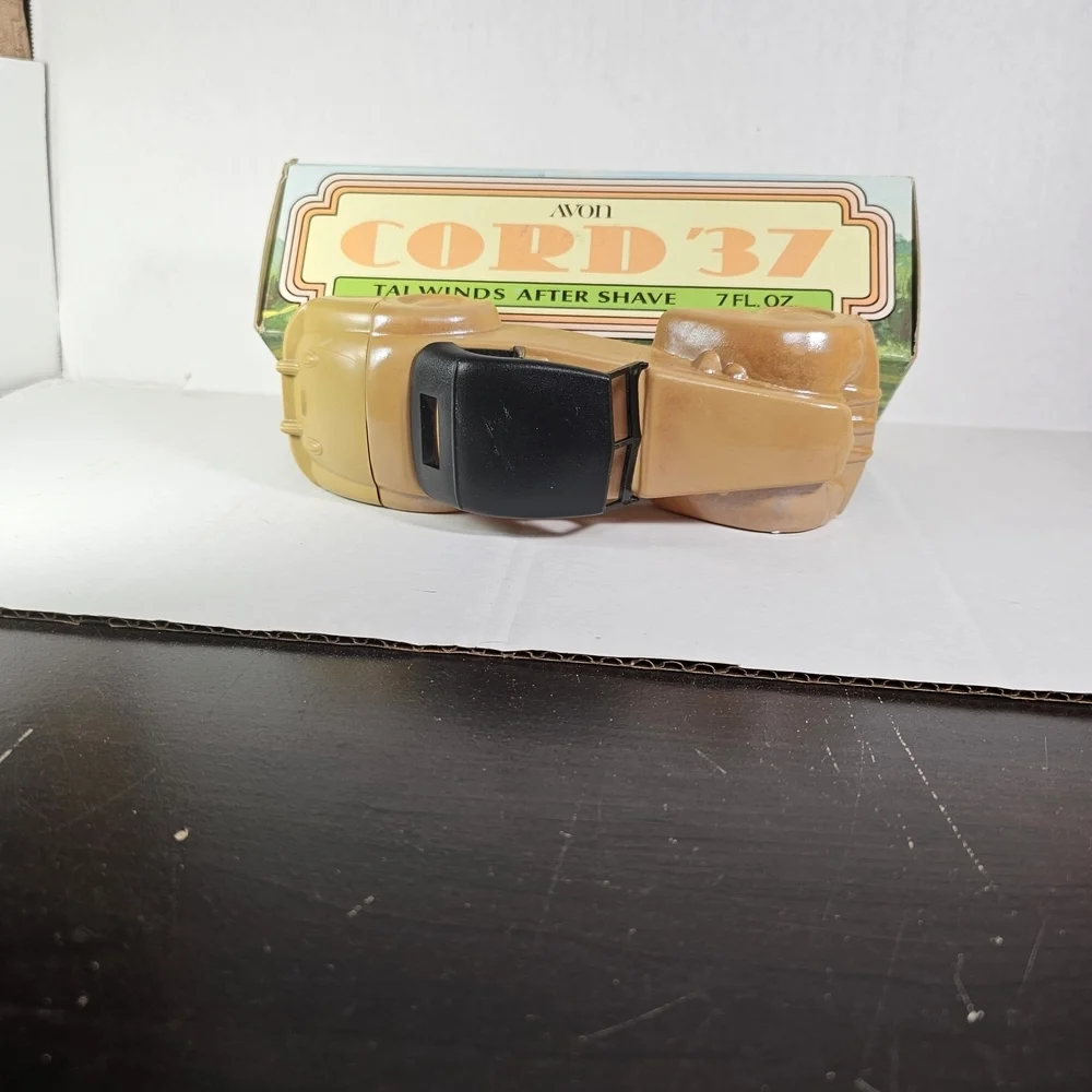 Avon Cord 37 Car Bottle. Tan Tai Winds After Shave Bottle